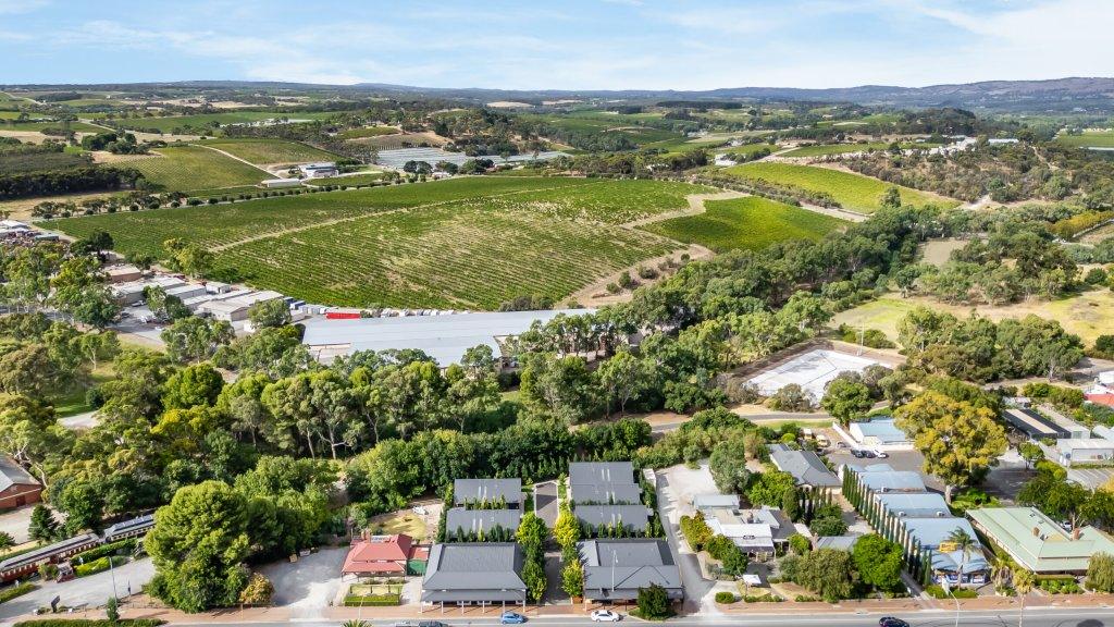 Accommodation in McLaren Vale at Vale 194 Vale 194 in foreground in the middle of the McLaren Vale Main Street with vineyards in the distance