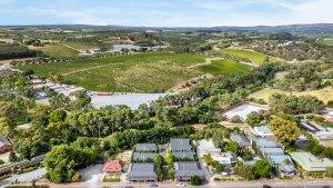 Accommodation in McLaren Vale at Vale 194 Vale 194 in foreground in the middle of the McLaren Vale Main Street with vineyards in the distance
