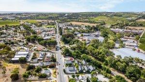 Accommodation in McLaren Vale at Vale 194 Vale 194 in foreground in the middle of the McLaren Vale Main Street with vineyards and ocean in the distance