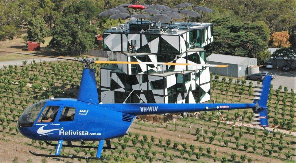 Helivista Helicopter in front of the D'Aarenberg Cube with vineyards