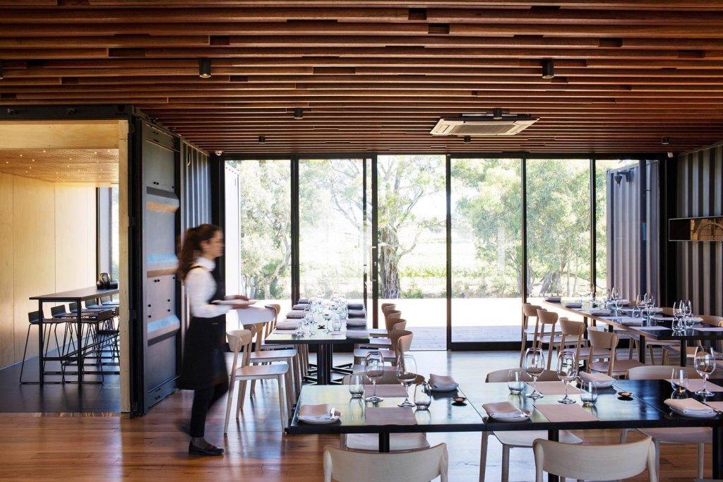 Little wolf osteria Mitolo wines dining tables set with a waitress serving food