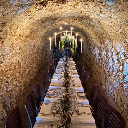 Maxwell Wines Cave set for a formal dinner with a candelabra on the table. Location McLaren Vale