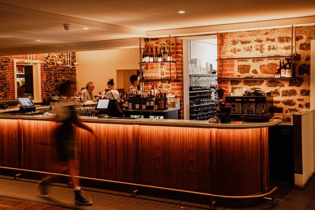McLaren Vale Hotel with beautiful modern bar with backlighting and staff serving customers