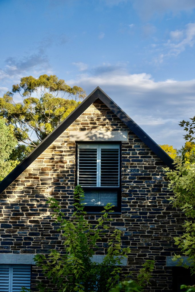 Vale 194 Luxury Accommodation in the heart of McLaren Vale top window of a stone fronted cottage with branches from trees