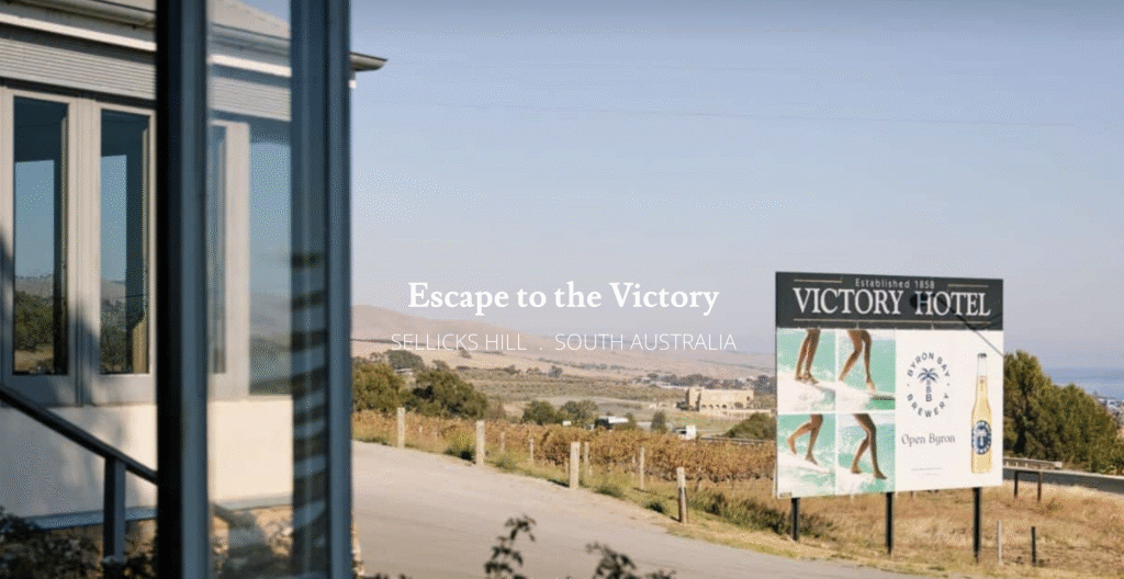 Victory Hotel Selick beach view in background and sign